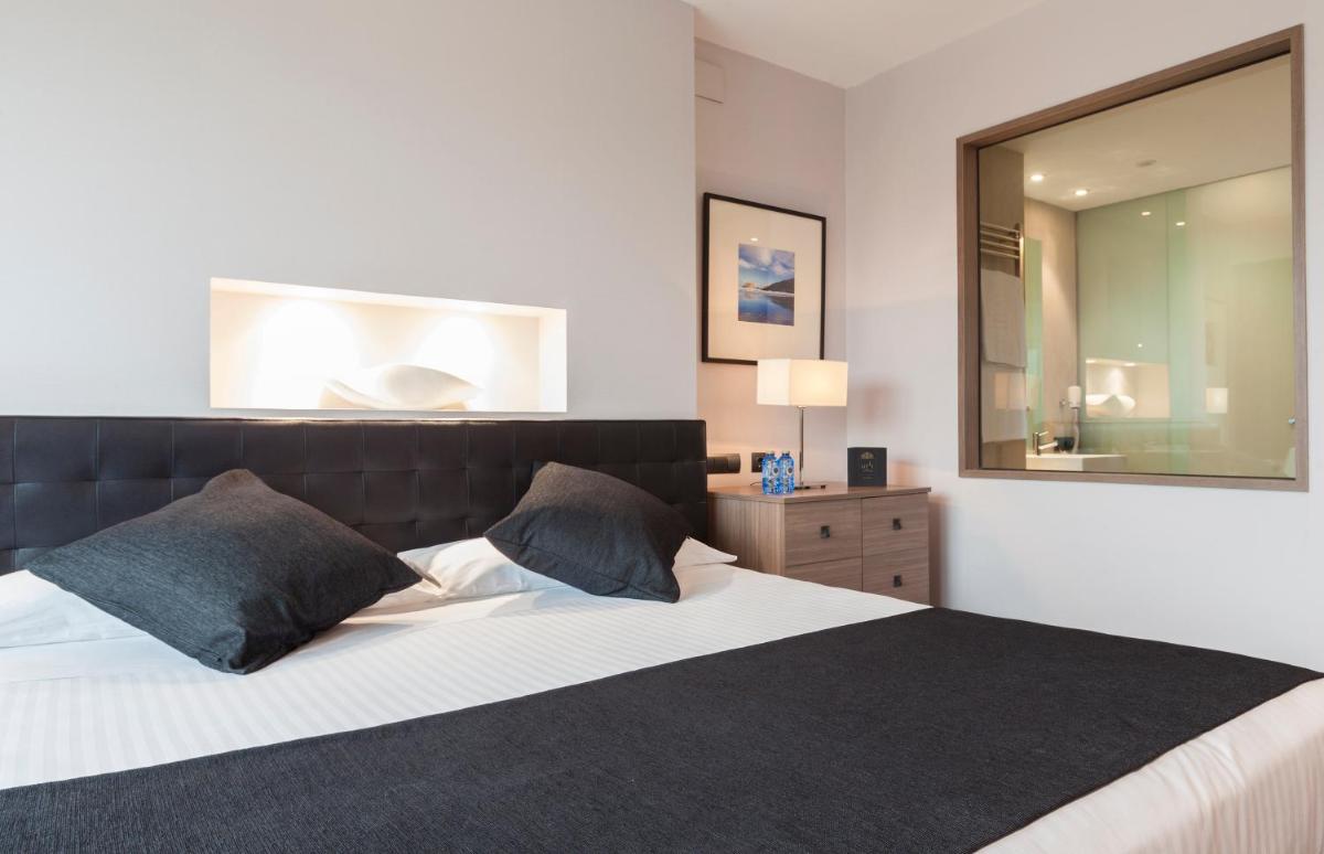 Cama o camas de una habitación en URH Hotel Spa Zen Balagares