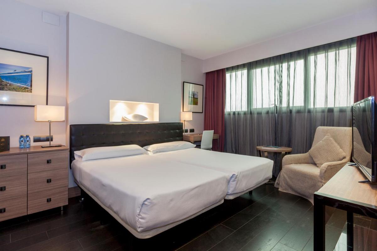 Cama o camas de una habitación en URH Hotel Spa Zen Balagares