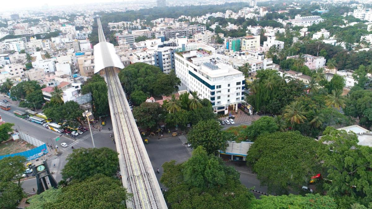 an aerial view of a city with a tower at La Marvella, Bengaluru in Bengaluru