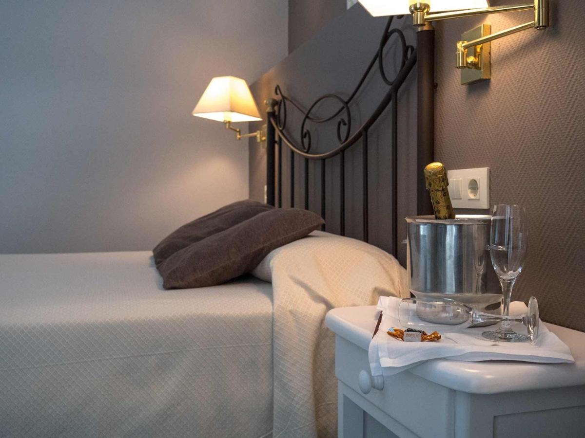Cama o camas de una habitación en Hotel Spa Bosque mar