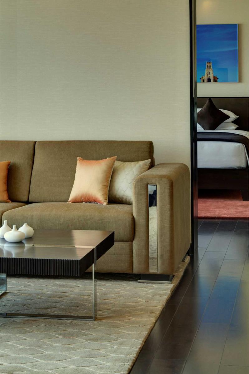a living room with a couch and a coffee table at Park Hyatt Hotel and Residences, Hyderabad in Hyderabad +90 photos