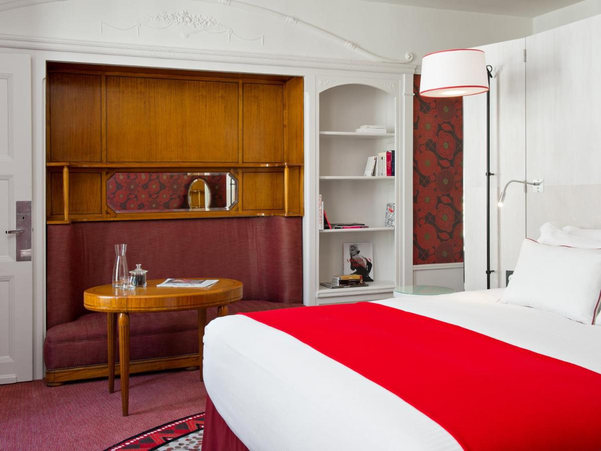 Un ou plusieurs lits dans un hébergement de l'établissement Carlton Hotel Lyon - MGallery Collection