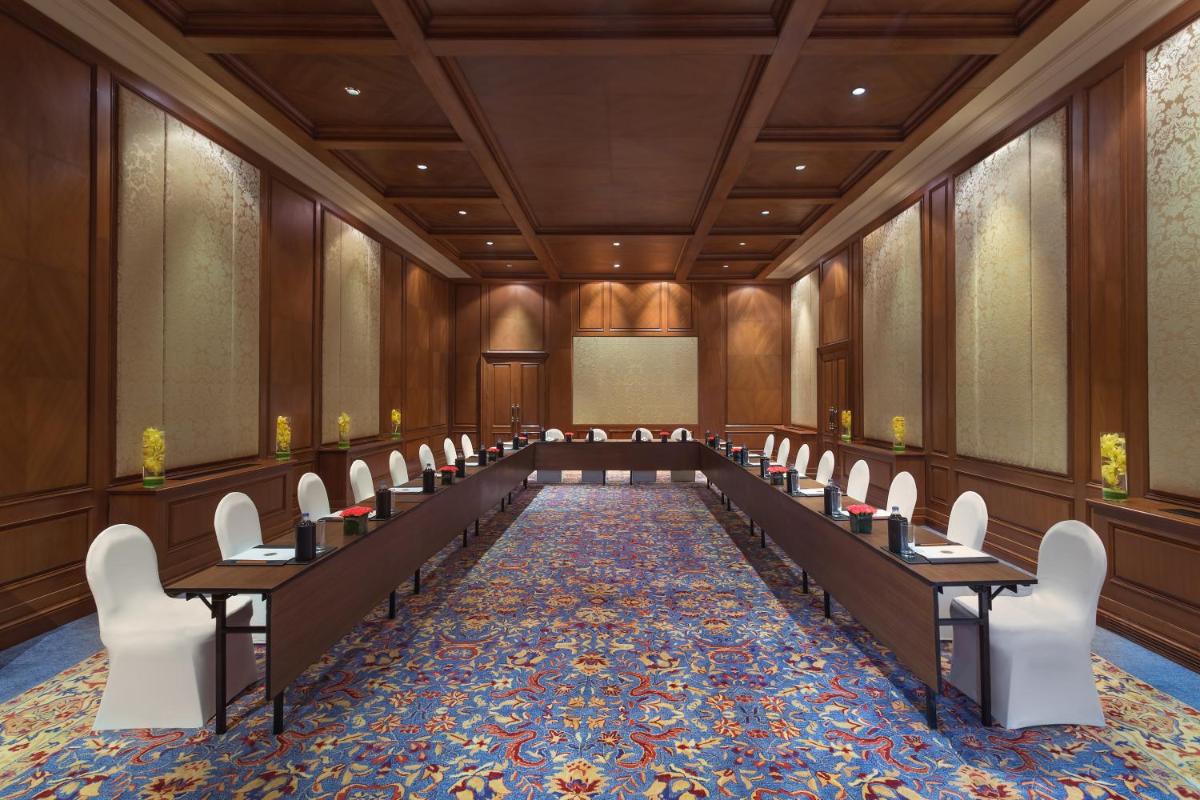 a conference room with desks and chairs in it at Welcomhotel by ITC Hotels, The Savoy, Mussoorie in Mussoorie