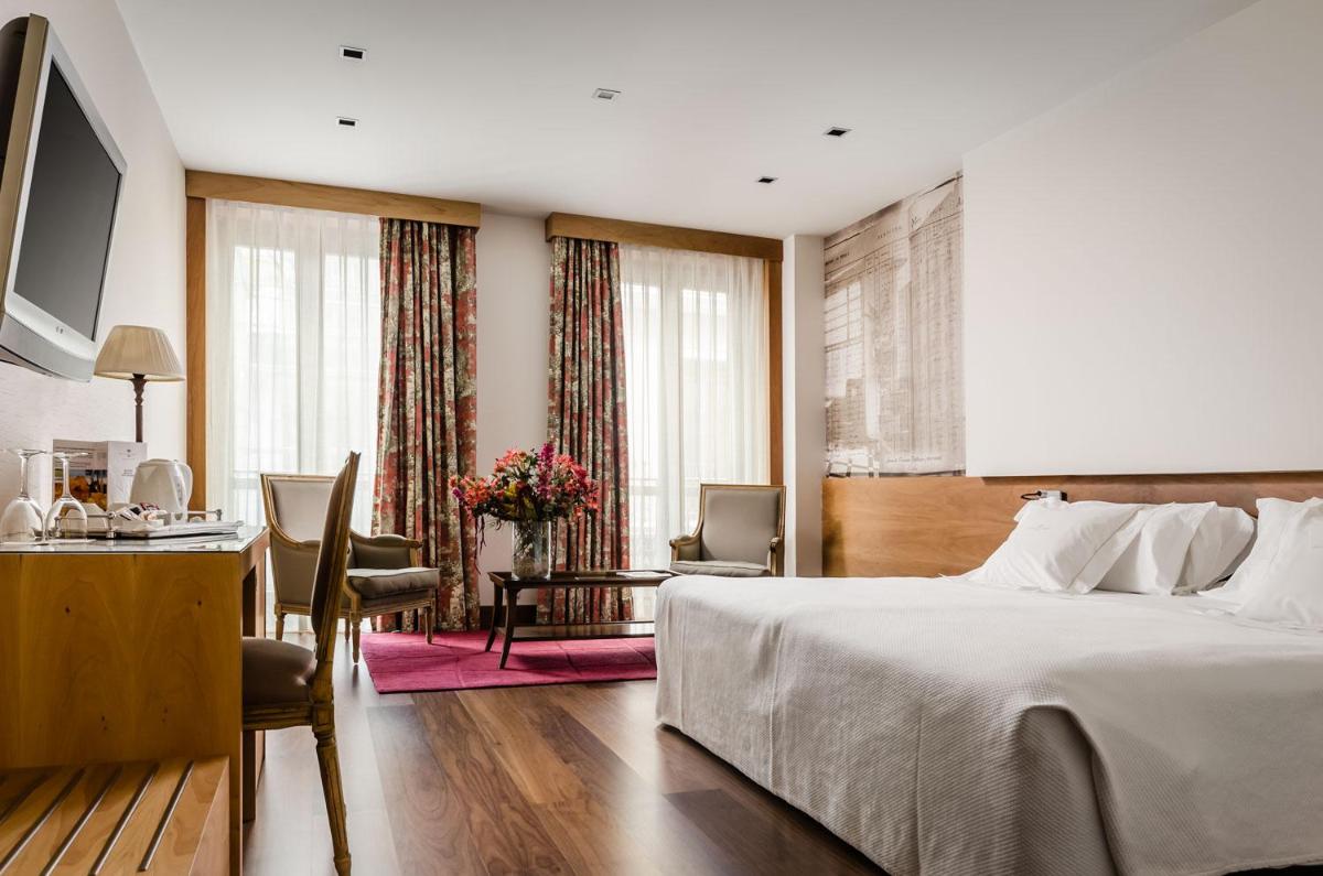 Cama o camas de una habitación en Gran Hotel La Perla