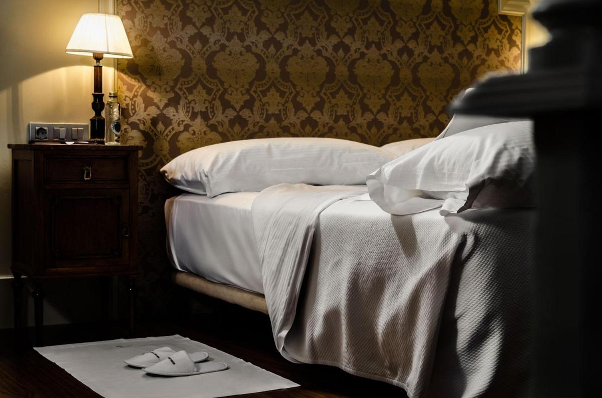 Cama o camas de una habitación en Gran Hotel La Perla