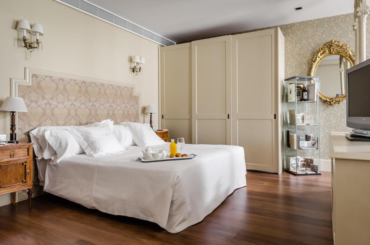 Cama o camas de una habitación en Gran Hotel La Perla