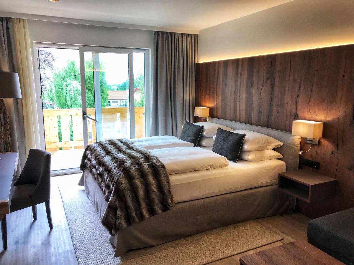 Ein Bett oder Betten in einem Zimmer der Unterkunft Alpenhof Murnau
