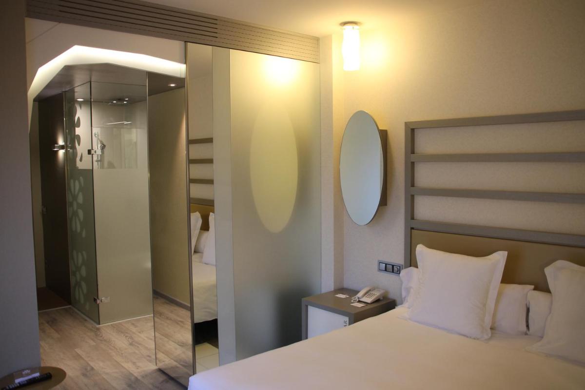 Cama o camas de una habitación en Hotel & Spa Princesa Munia