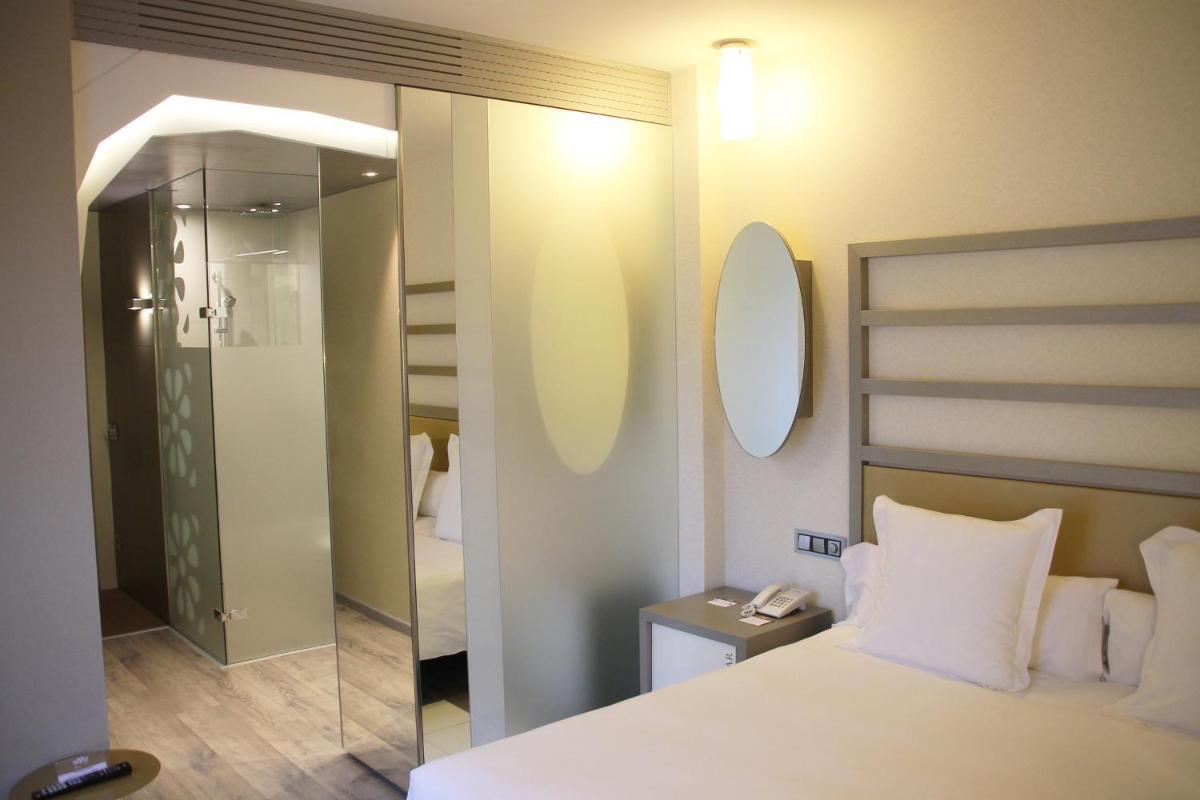 Cama o camas de una habitación en Hotel & Spa Princesa Munia