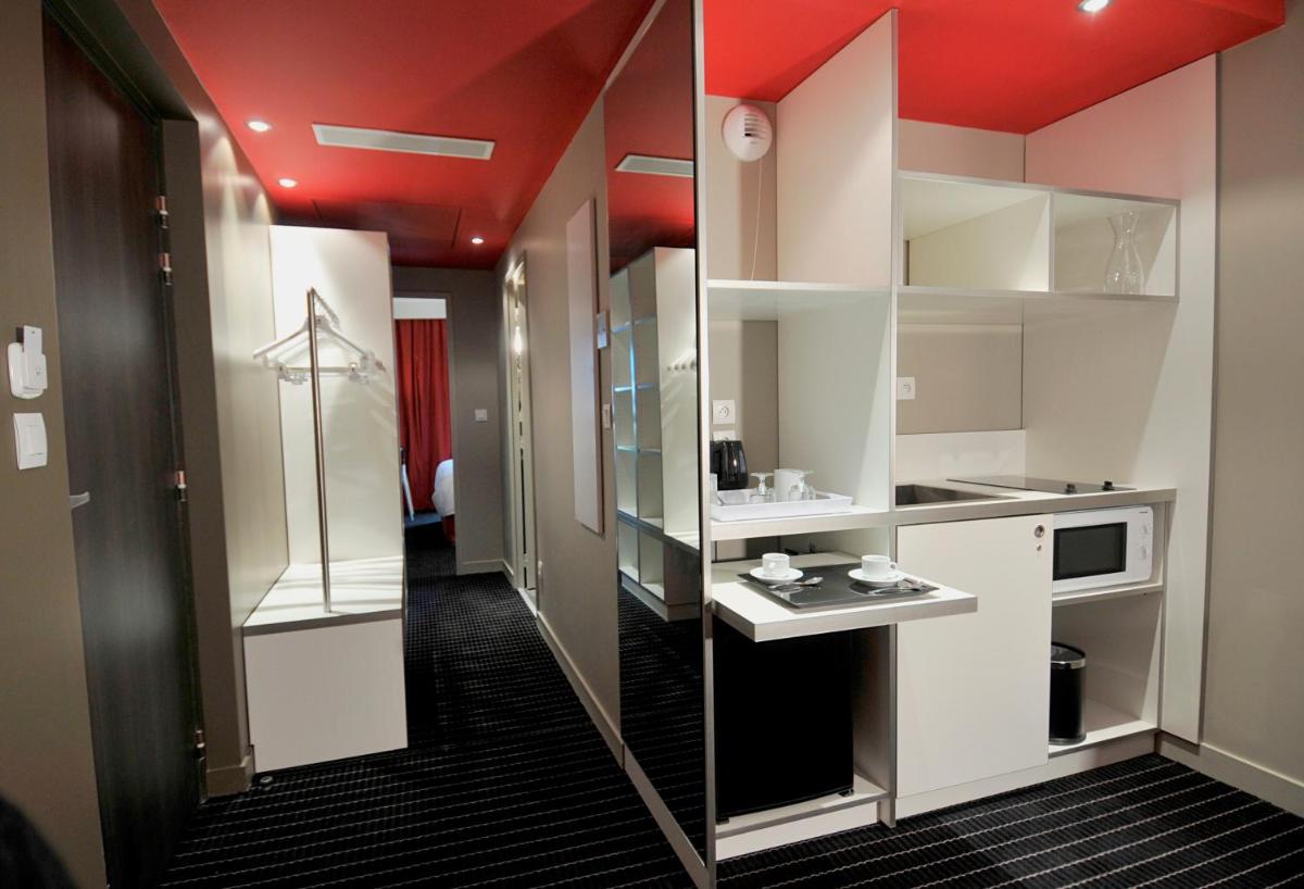 Cuisine ou kitchenette dans l'établissement B&B HOME Lyon Centre Berthelot