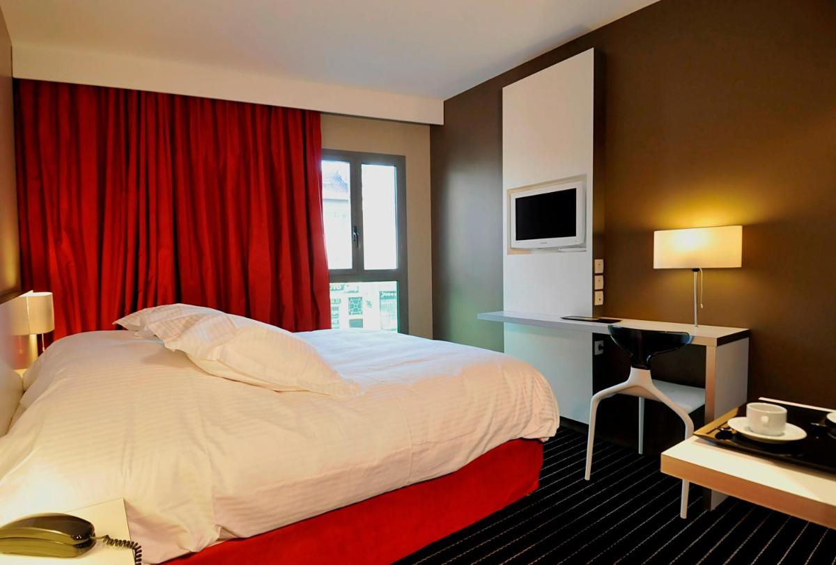 Un ou plusieurs lits dans un hébergement de l'établissement B&B HOME Lyon Centre Berthelot