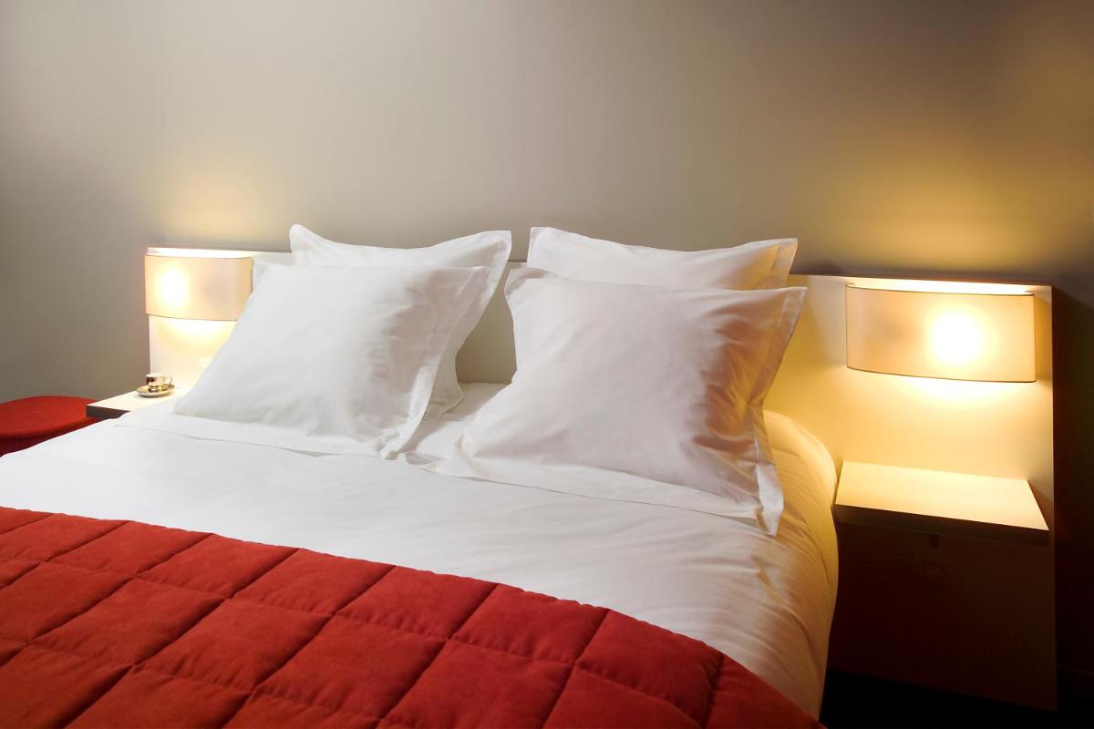 Un ou plusieurs lits dans un hébergement de l'établissement B&B HOME Lyon Centre Berthelot