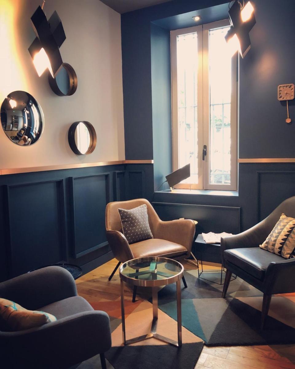 Coin salon dans l'établissement Alex Hotel & Spa