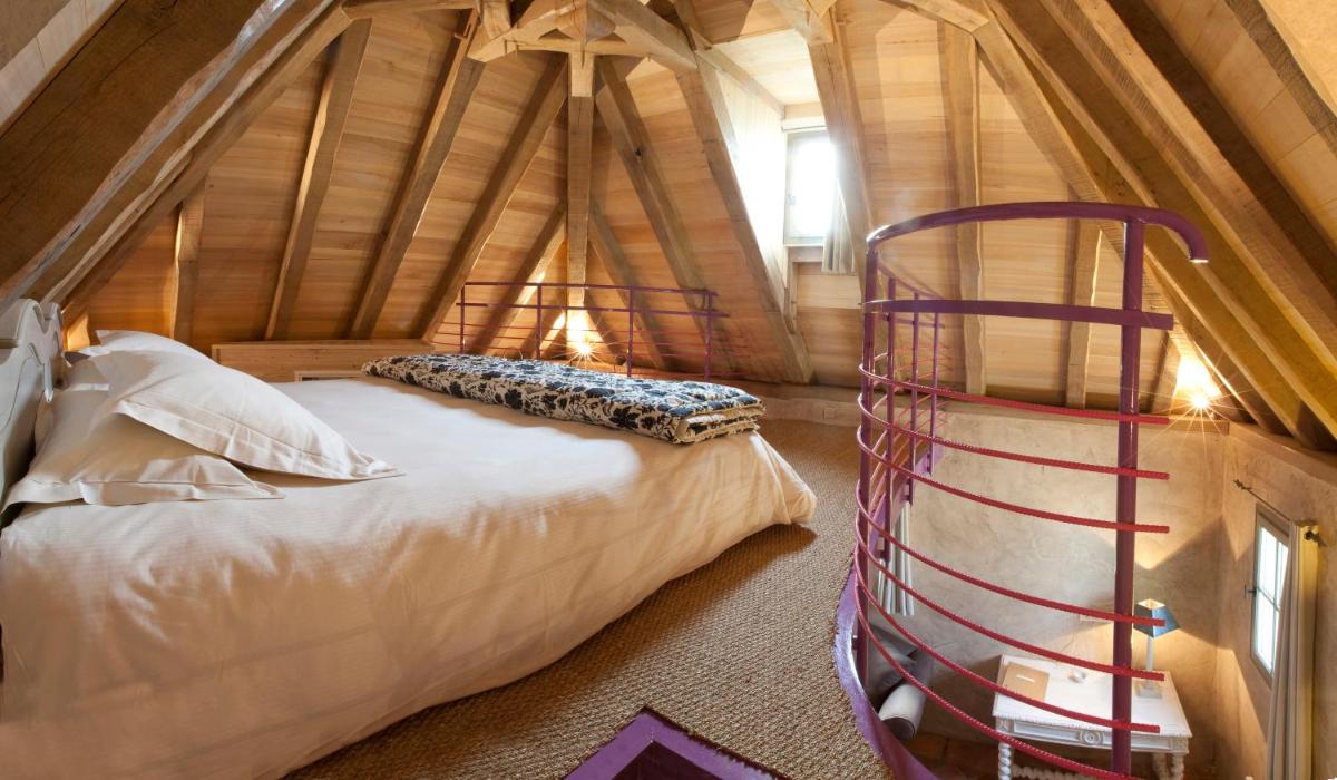 Un ou plusieurs lits dans un hébergement de l'établissement Hôtel-Spa Le Saint Cirq