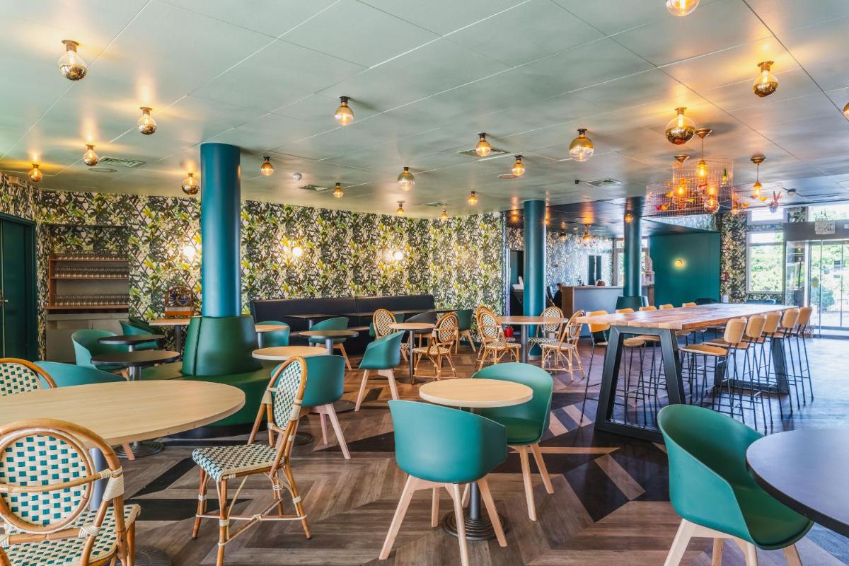 Restaurant ou autre lieu de restauration dans l'établissement Best Western Hôtel Grand Parc Marne La Vallée