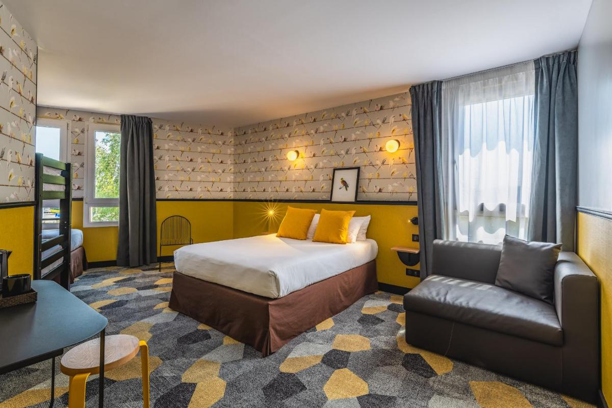 Coin salon dans l'établissement Best Western Hôtel Grand Parc Marne La Vallée