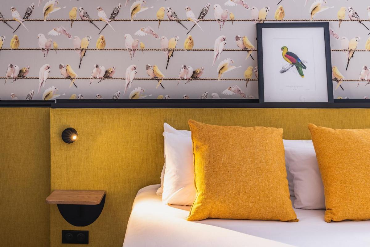 Un ou plusieurs lits dans un hébergement de l'établissement Best Western Hôtel Grand Parc Marne La Vallée