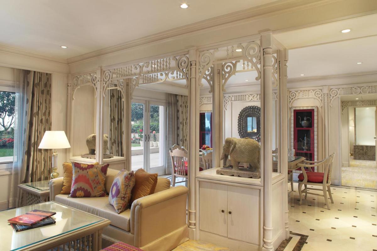 a living room with a couch and a table at Taj Palace, New Delhi in New Delhi a living room with a couch and a table at Taj Palace, New Delhi in New Delhi