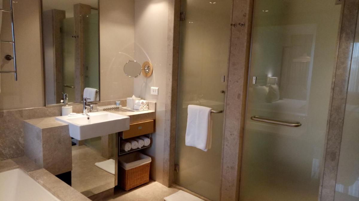 a bathroom with a sink and a shower at Welcomhotel by ITC Hotels, RaceCourse, Coimbatore in Coimbatore