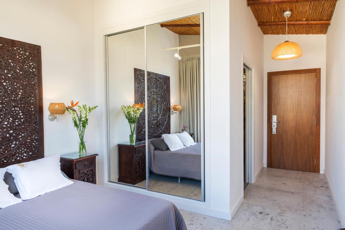 Cama o camas de una habitación en Essence Hotel Boutique