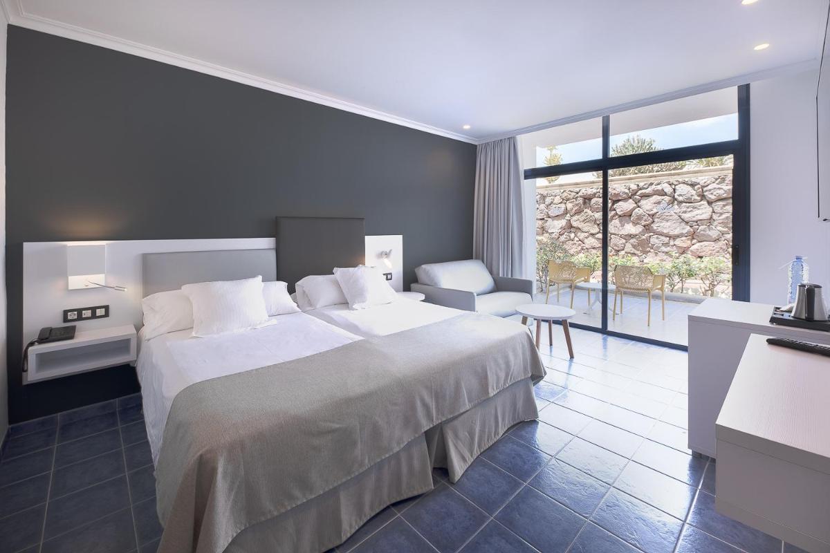 Cama o camas de una habitación en Hotel Mirador Papagayo by LIVVO