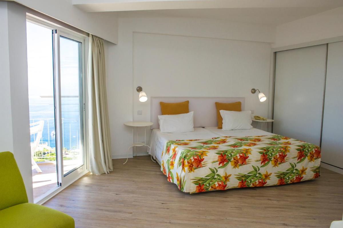 Uma cama ou camas num quarto em Florasol Residence Hotel - Dorisol hotels