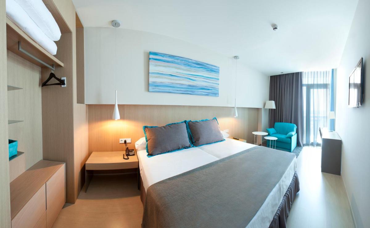 Cama o camas de una habitación en Atenea Port Barcelona Mataró