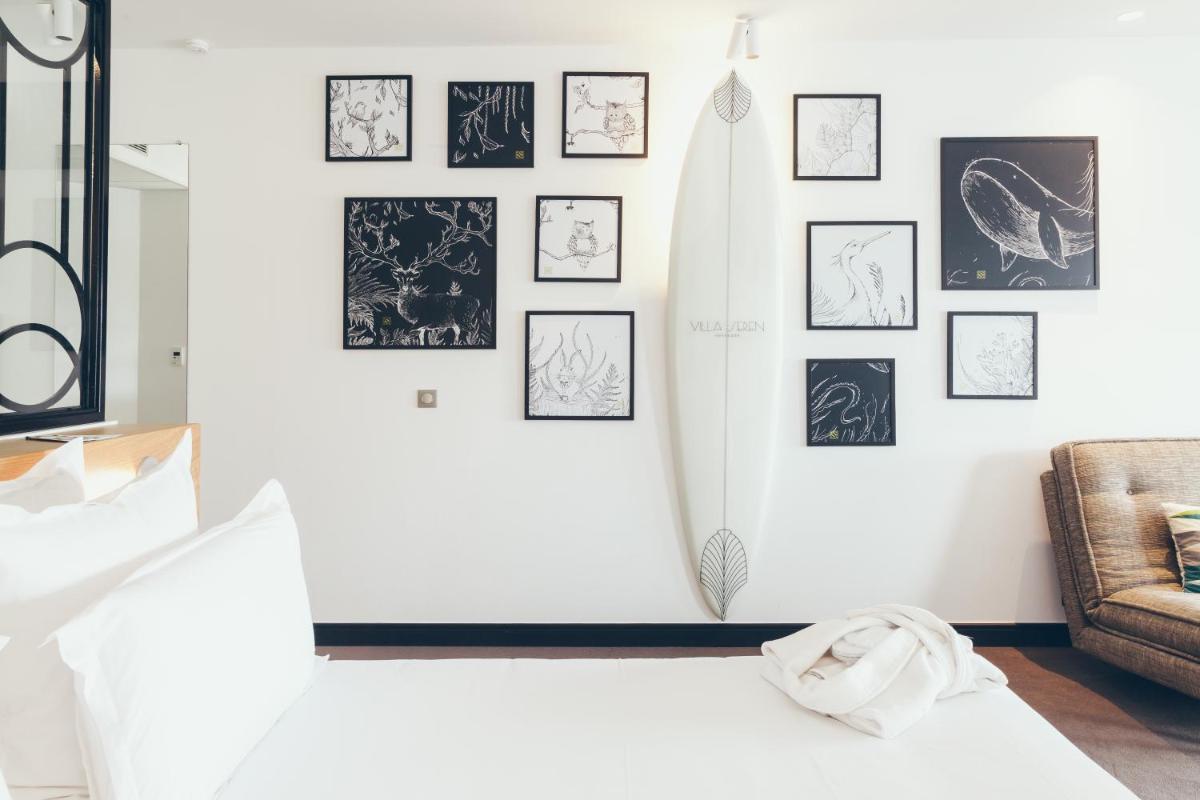 Un ou plusieurs lits dans un hébergement de l'établissement Hôtel & Spa Villa Seren