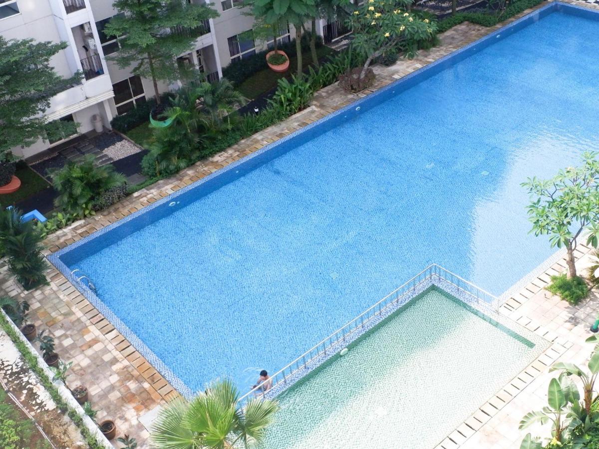 Cozy 1BR Scientia Residence Apartment near Summarecon Mall Gading Serpong By Travelio - Housity