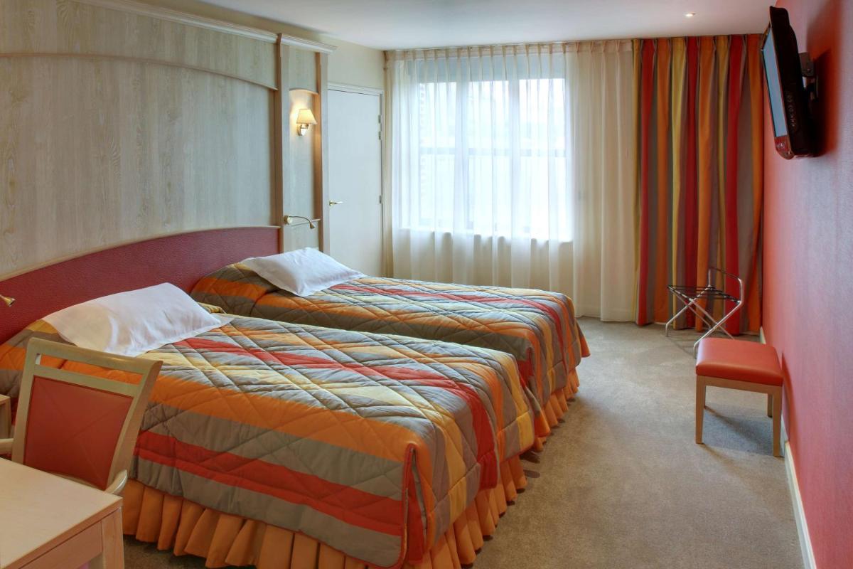 Un ou plusieurs lits dans un hébergement de l'établissement Best Western La Metairie