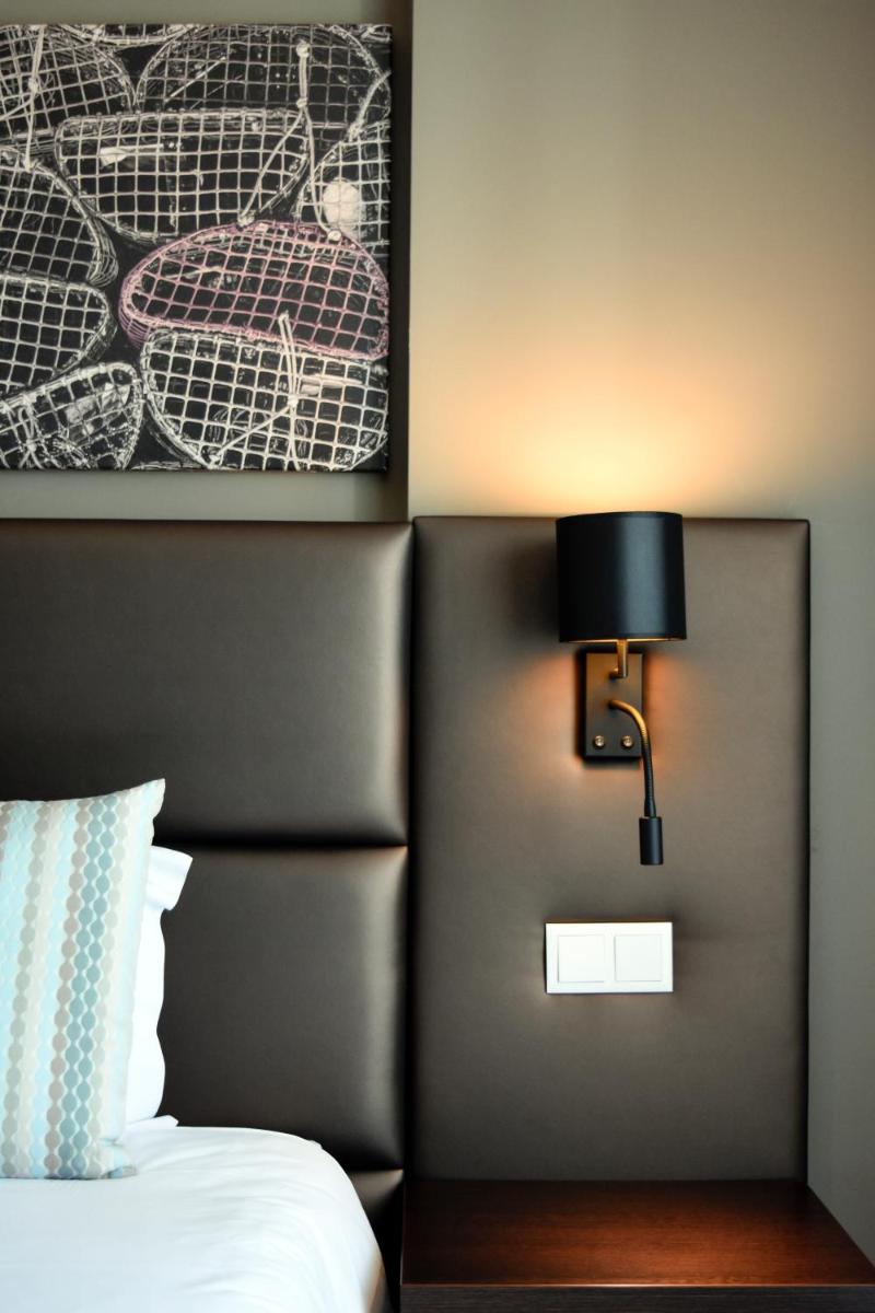 Uma cama ou camas num quarto em AP Maria Nova Lounge - Adults Friendly