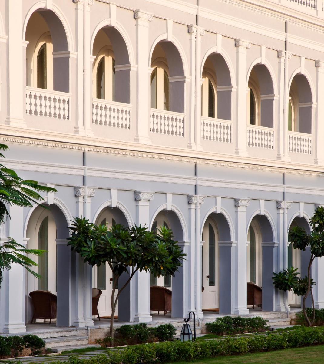 a large white building with a balcony at Taj Falaknuma Palace in Hyderabad