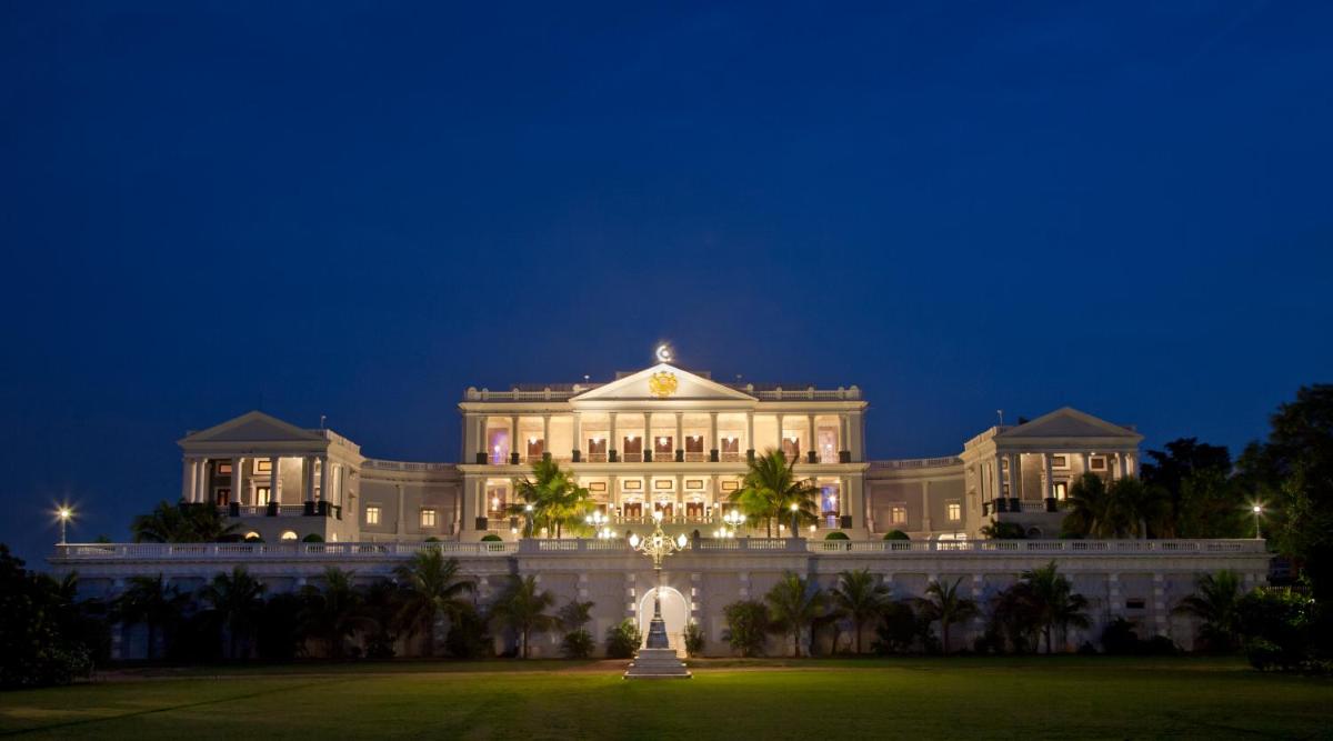 a building with a fountain in front of it at night at Taj Falaknuma Palace in Hyderabad