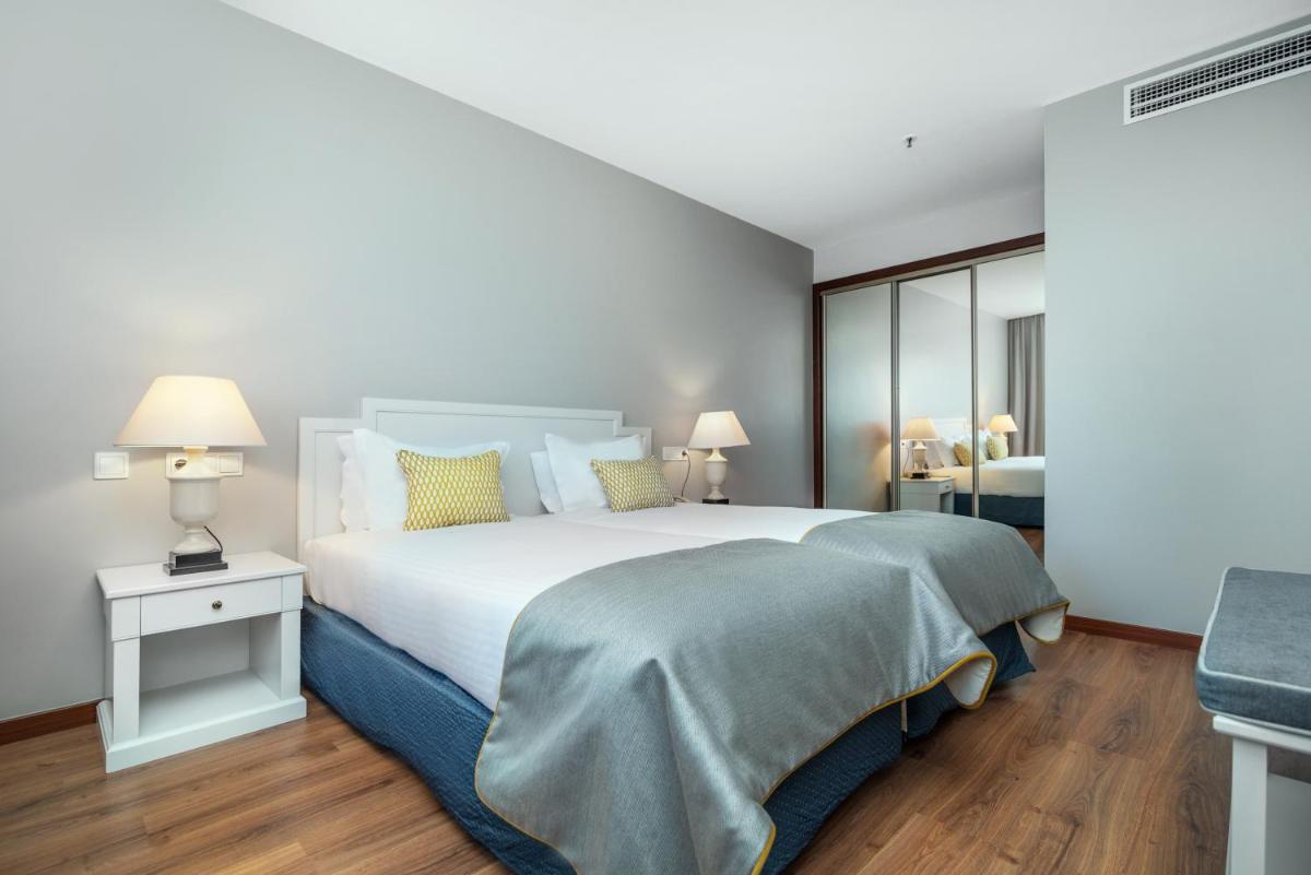 Uma cama ou camas num quarto em Gaia Residence