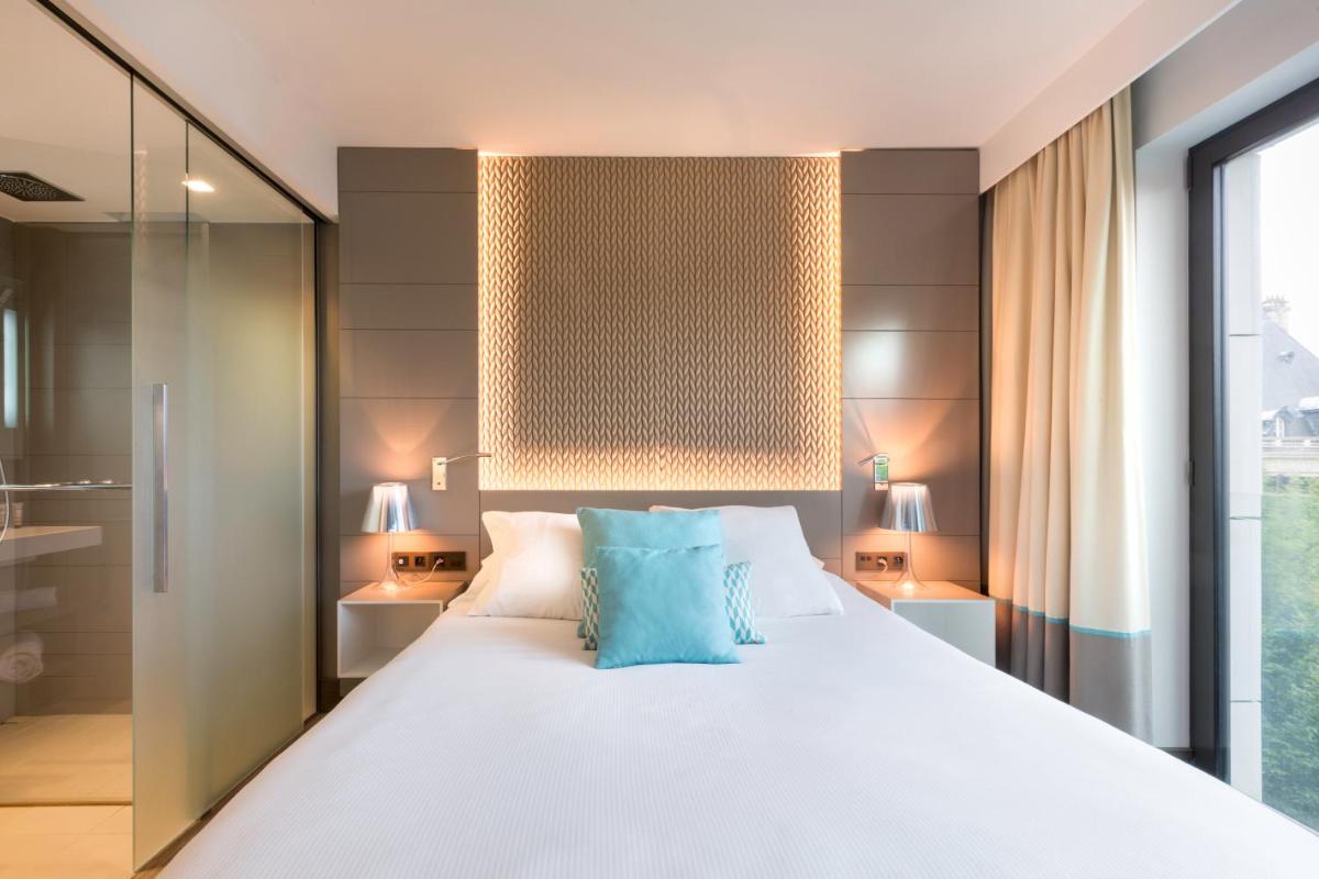 Un ou plusieurs lits dans un hébergement de l'établissement BW Premier Collection Le Saint Antoine Hotel et Spa