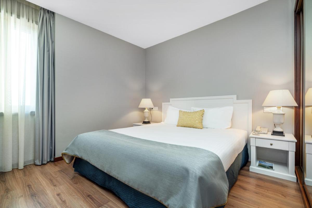 Uma cama ou camas num quarto em Gaia Residence