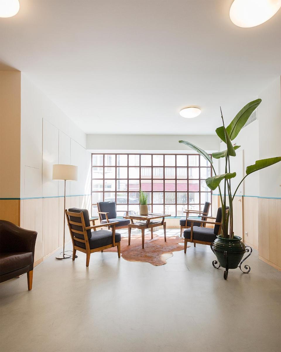 Uma área de estar em Hotel Meira