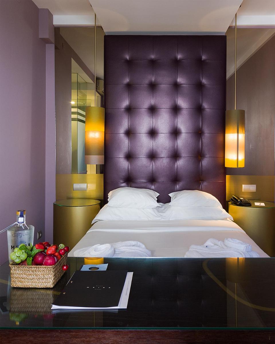 Uma cama ou camas num quarto em Hotel Meira