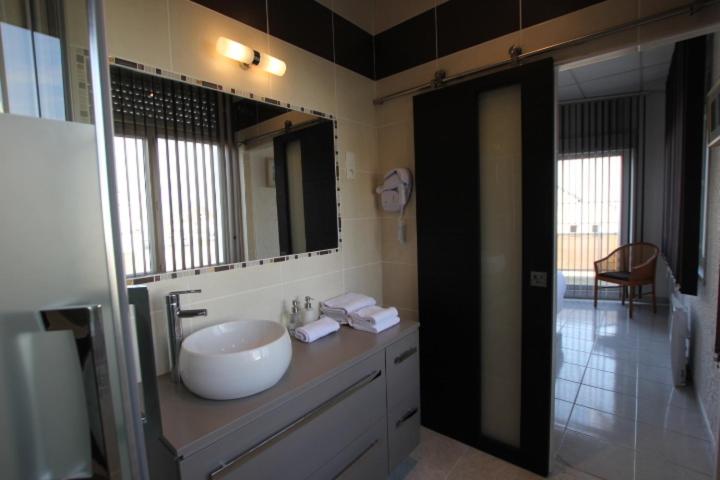 Salle de bains dans l'établissement La Maison Blanche