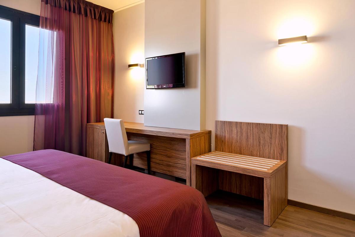 Cama o camas de una habitación en Dña Monse Hotel Spa & Golf