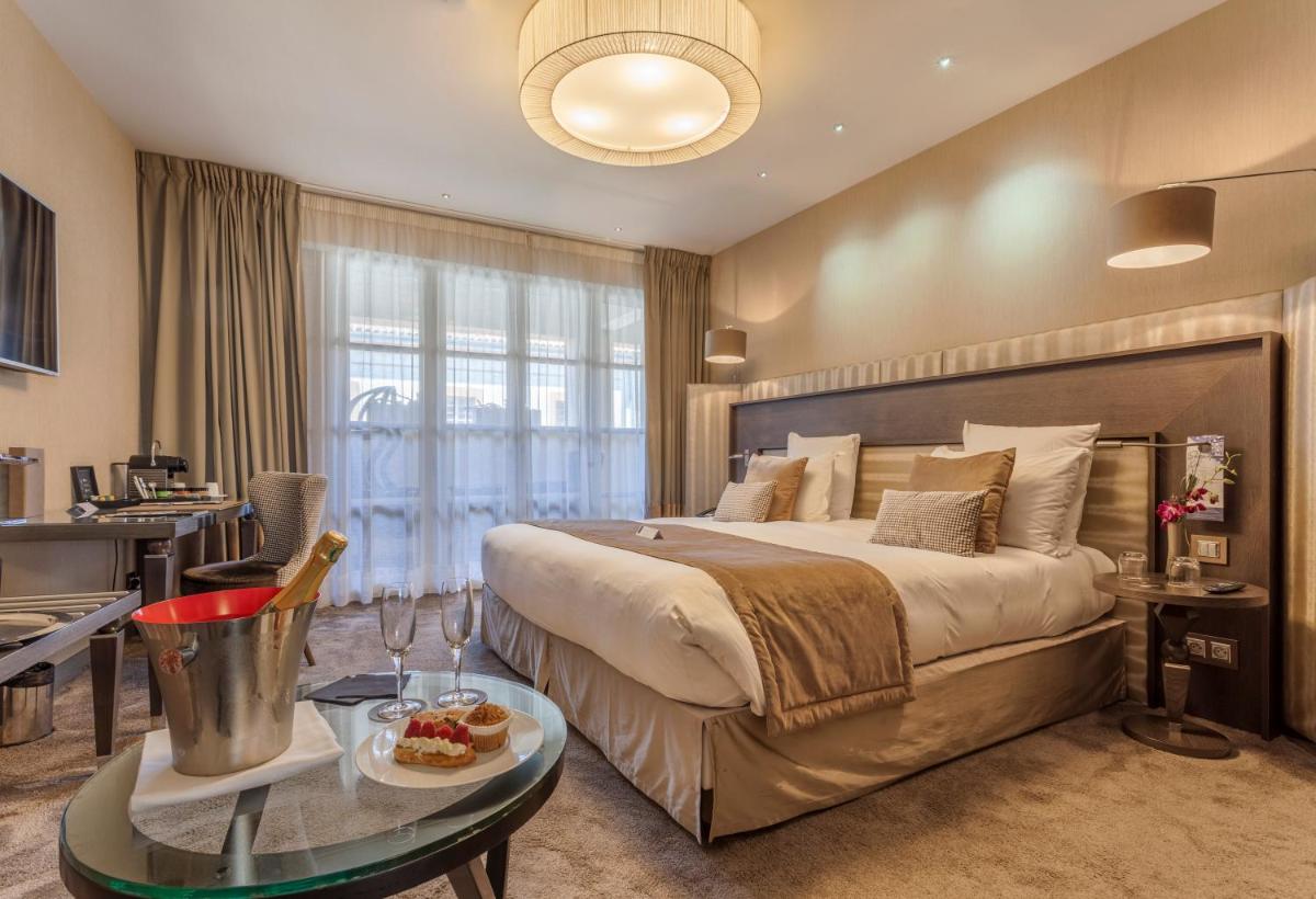 Un ou plusieurs lits dans un hébergement de l'établissement La Cour des Consuls Hotel & Spa Toulouse - MGallery Collection