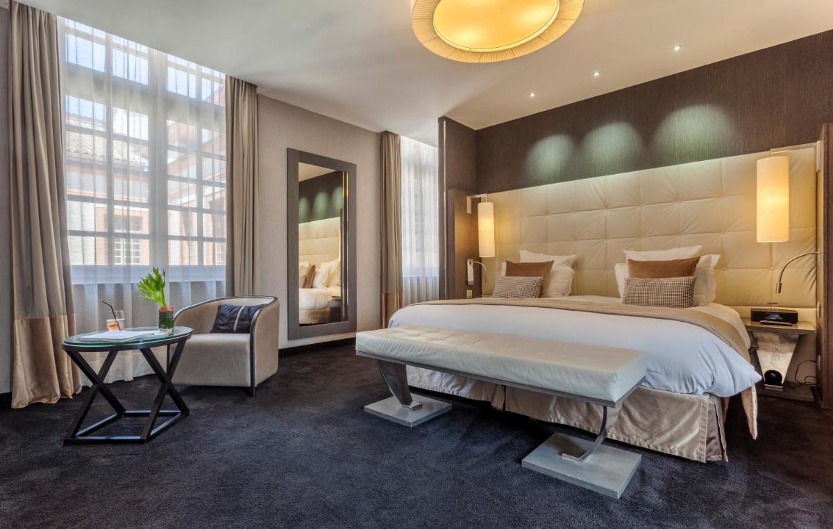 Un ou plusieurs lits dans un hébergement de l'établissement La Cour des Consuls Hotel & Spa Toulouse - MGallery Collection