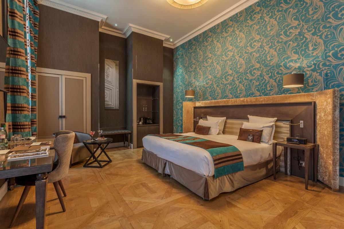 Un ou plusieurs lits dans un hébergement de l'établissement La Cour des Consuls Hotel & Spa Toulouse - MGallery Collection