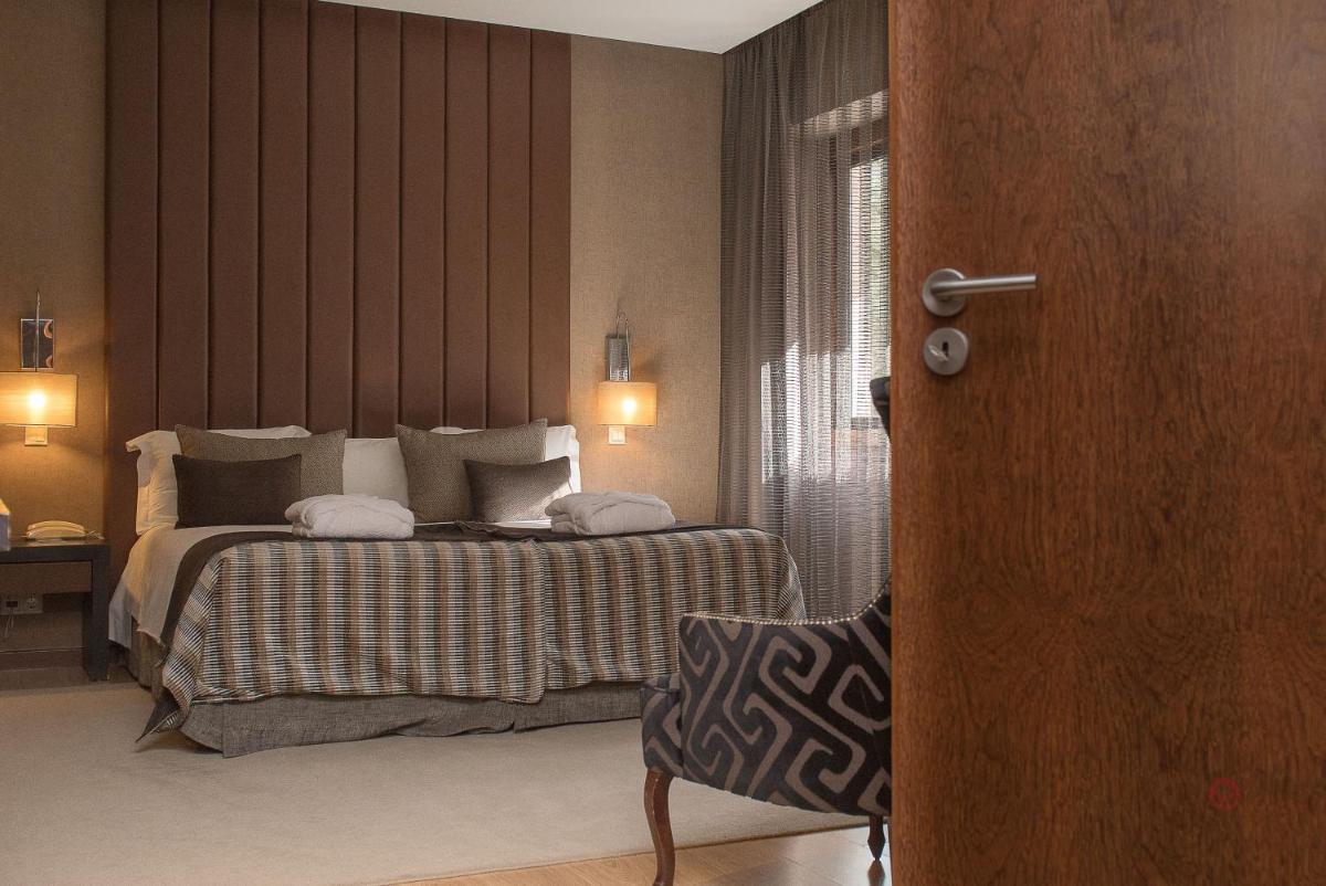 Uma cama ou camas num quarto em Your Hotel & Spa Alcobaça