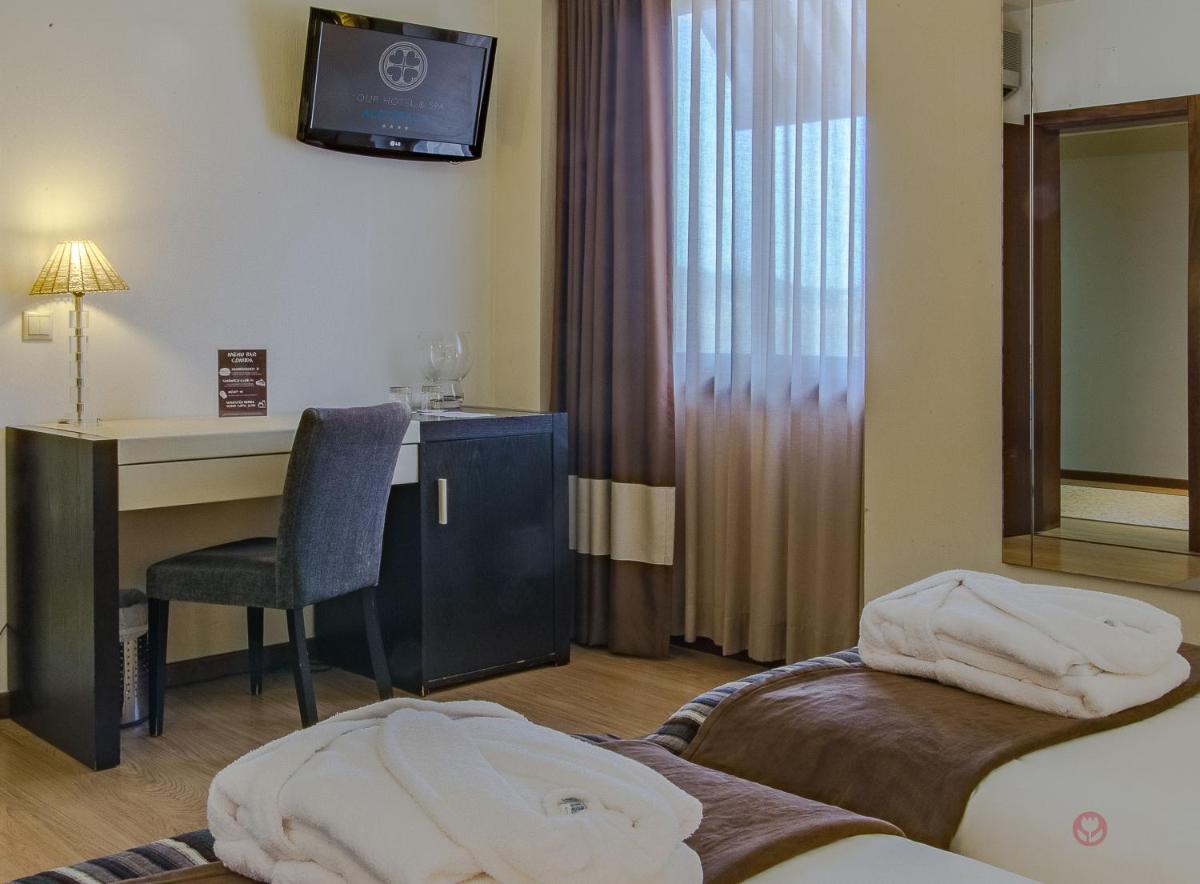 Uma cama ou camas num quarto em Your Hotel & Spa Alcobaça