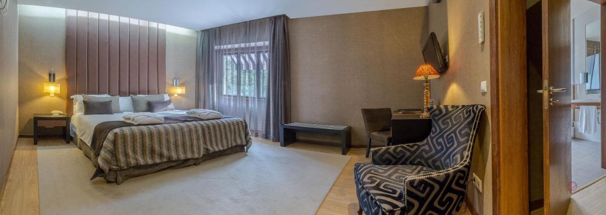 Uma cama ou camas num quarto em Your Hotel & Spa Alcobaça