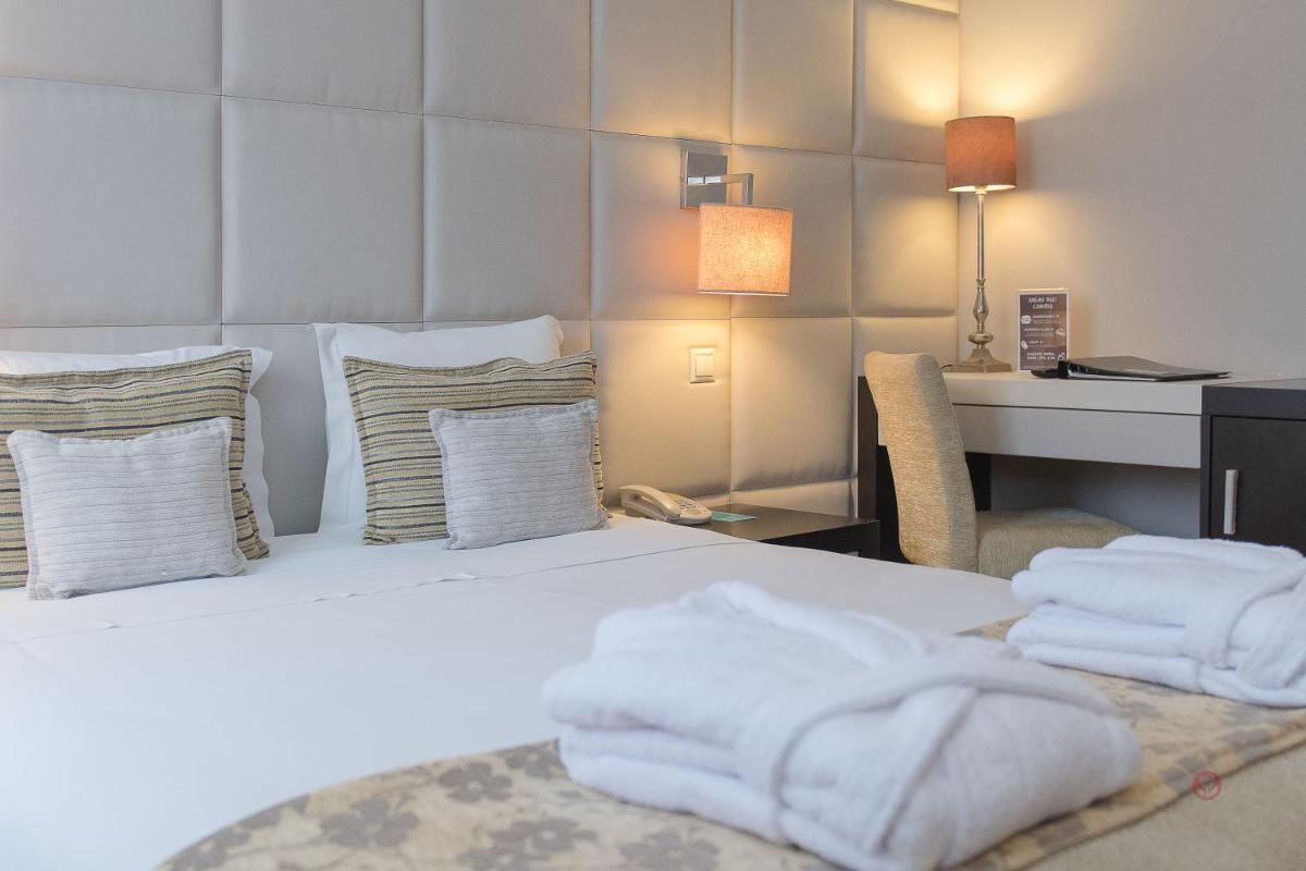 Uma cama ou camas num quarto em Your Hotel & Spa Alcobaça