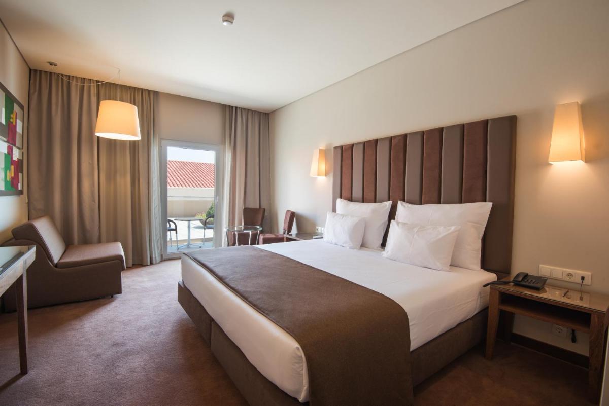 Uma cama ou camas num quarto em Vila Gale Collection Braga
