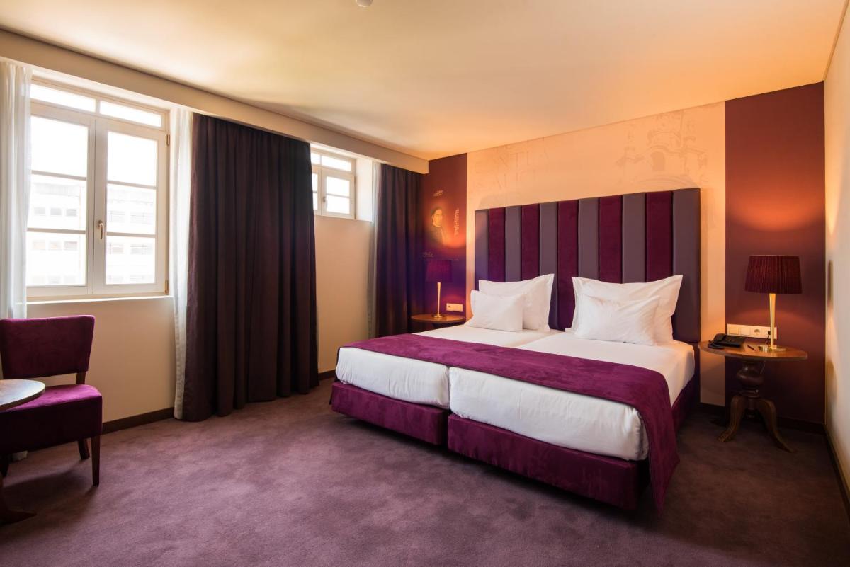 Uma cama ou camas num quarto em Vila Gale Collection Braga