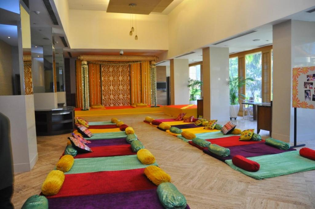 a room with a row of yoga mats on the floor at The Retreat Hotel & Convention Centre in Mumbai